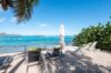 Beachfront loungers overlooking turquoise waters at Villa Plumbago, Colombier, private villa rentals St Barts