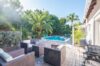Outdoor lounge and private pool surrounded by tropical palms at Villa Plumbago, Colombier, St Barts villa rentals.