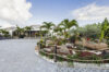 St Barts villa with landscaped tropical garden, palm trees, and stone driveway leading to the main residence.