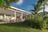 Modern open-air living room overlooking tropical gardens at a luxury villa in St Barts