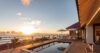 Sunset view from luxury St Barts villa terrace with private pool and loungers