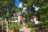 Secluded villa entrance surrounded by lush tropical gardens in luxury St Barts rental.
