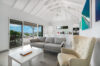 Bright living room with vaulted ceiling and terrace access at St Barthelemy vacation rental