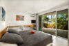 Guest bedroom in St Barts vacation rental with terrace access and garden views