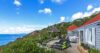 Hillside villa with red roof, ocean view terrace, and gazebo at St Barts vacation rental