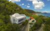 Hillside St Barts villa with infinity pool overlooking Caribbean Sea and nearby beach.