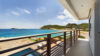 Balcony with oceanfront view overlooking pool and coastline at a St Barts villa rental