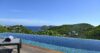 Infinity pool with hillside and ocean panorama at a luxury St Barts villa rental