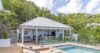 Pool terrace with loungers and hillside views at a private St Barts villa rental