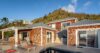Contemporary villa with cedar-shingle facades, sun loungers, and poolside terrace in St Barts vacation rental.
