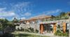 Stone façade of hillside St Barts villa with garden terrace and panoramic views