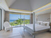 Stylish bedroom at Villa Loukoko in St Barts with king-size bed and ocean-facing windows