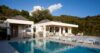 Contemporary St Barts villa with poolside loungers and hillside views