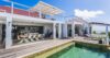 Outdoor dining terrace of St Barthelemy rentals with poolside deck and ocean views