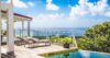 Pool deck of St Barts luxury rentals with sun loungers and sweeping ocean views”