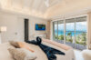 Bright bedroom with ocean view terrace and modern decor at St Barthelemy villa rental