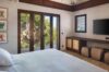 Cozy bedroom decorated with island-inspired natural materials, creating a warm and earthy atmosphere.