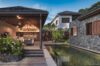 Serene pool surrounded by lush natural greenery, creating a peaceful, nature-inspired atmosphere.
