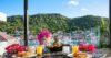 Lunch table set on a terrace with a beautiful view of the surrounding landscape