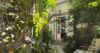 Lush tropical garden with greenery leading to cozy villa entrance in St Barts vacation rental