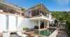 Beautiful view of a villa surrounded by lush natural greenery and scenic landscape