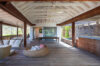 Lounge area on a terrace, featuring stylish outdoor seating and a beautiful view of the surrounding landscape