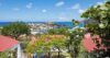 Scenic ocean view from a villa, with the sea stretching out to the horizon and natural surroundings enhancing the tranquil atmosphere