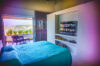 Bedroom in St Barthelemy vacation rentals with flat-screen TV and terrace seating