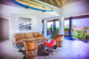 Stylish living room in St Barts villa rentals with surfboard decor and ocean views