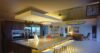 Spacious modern kitchen at St Barts villa with island seating and warm lighting