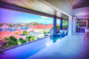 Infinity pool at luxury St Barts villa with panoramic harbor and hillside views