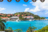 Scenic view of Gustavia harbor from a St Barts villa rental with turquoise waters and red rooftops.