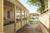 Charming veranda walkway of a St Barts vacation rental overlooking Gustavia harbor.