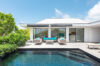 Tropical villa garden with palm trees and ocean view in St Barts