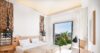 Bright bedroom in a St Barts villa rental with terrace view of tropical gardens and ocean horizon