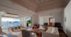 Lounge area inside a beautiful modern villa, featuring stylish furniture and contemporary design elements.
