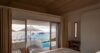 Beautiful view from inside a bedroom, seen through large windows overlooking the surrounding landscape.