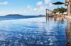 Seafront infinity pool at St Barts villa with loungers and panoramic Caribbean views