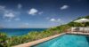 Cliffside infinity pool at luxury villas St Barts with panoramic ocean and hillside views