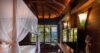 Cozy bedrooms featuring large windows with breathtaking views.