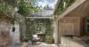 Beautiful garden with greenery and relaxing spaces.