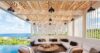 Shaded outdoor lounge in villa st barths with ocean view and infinity pool.