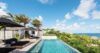 Infinity pool at luxury villas St Barts with ocean and tropical hillside views.