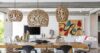 Stylish dining area in St Barts villa with wicker pendant lights and modern art décor