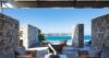Stone terrace lounge at St Barts villa with ocean view seating and open design