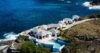 Seafront infinity pool at St Barts villa with sun loungers and Caribbean horizon