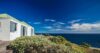 Seaside villa in St Barts with green roof and panoramic view of the deep blue Caribbean Sea.