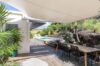 Terrace lounge area surrounded by nature, featuring comfortable seating and scenic vistas.