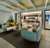 Elegant open-air lounge at a St Barts villa with evening lighting and seamless flow into the dining area.