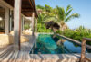 nfinity pool surrounded by lush greenery, blending seamlessly with the natural landscape